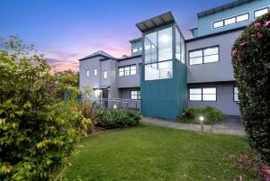 an exterior view of a house with a yard at Bruma on Bowen - Opposite Shark Net Beach in Huskisson