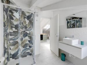a bathroom with a shower and a sink at Attic studio, with air conditioning in Castelsardo +21 photos