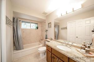 a bathroom with a sink and a toilet and a tub at Forest house 4 bedrooms in Surrey +11 photos