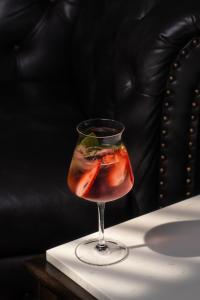 a drink in a glass on a table at Kantary Hotel Banchang in Ban Chang