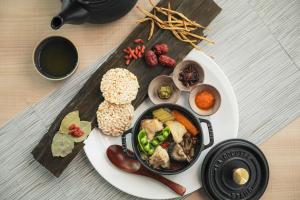 a plate of food with vegetables and other foods at The Gate Hotel Osaka by Hulic in Osaka