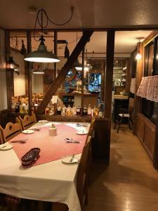 a dining room with a table in a restaurant at North Point Lodge in Minami Uonuma