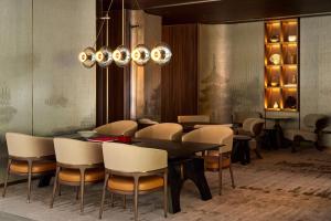 a dining room with a table and chairs at Dusit Thani Kyoto in Kyoto
