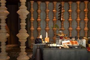 a room with wooden columns and a table with candles at Dusit Thani Kyoto in Kyoto +167 photos