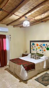 a bedroom with a large bed in a room at By Lela in Tinogasta
