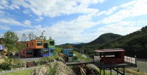 a group of colorful houses on a hill at Yeongwol cubezone in Yeongwol