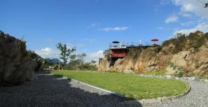 a road with a building on top of a mountain at Yeongwol cubezone in Yeongwol