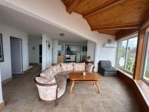 a living room with a couch and a table at Villa Nora in Albena