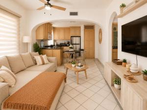 a living room with a couch and a table at Mykonos Recently remodeled 1BR Beach Escape great view! in San José del Cabo