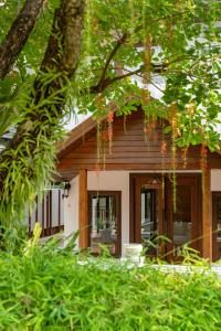 a house with a porch and a patio at Rimping Village in Chiang Mai