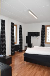 Postel nebo postele na pokoji v ubytování Hotel Rätia