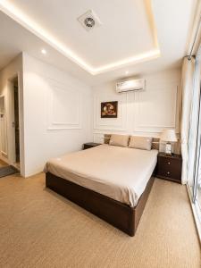 a bedroom with a large bed in a room at X-Stay Cloud in Hai Phong