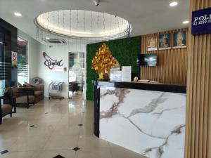 a lobby of a restaurant with a map on the wall at Country Hotel in Klang