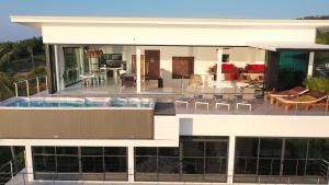 a house with a swimming pool and a patio at Villa Valentin in Salad Beach
