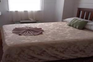 a bed with a dress on top of it at The Ashford Hotel and Restaurent in Ashford