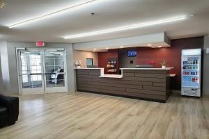 an empty waiting room with a drink counter in a pharmacy at Microtel Inn & Suites Claremore Route 66 in Claremore +38 photos