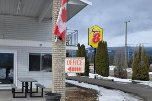 a sign outside of a fast food restaurant with a coffee sign at Super 8 by Wyndham Clearwater BC in Clearwater