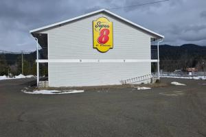 a building with a sign on the side of it at Super 8 by Wyndham Clearwater BC in Clearwater