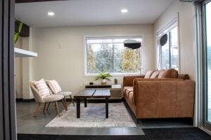 a living room with a couch and a table at Super 8 by Wyndham Clearwater BC in Clearwater +105 photos