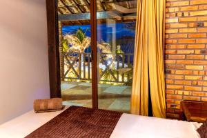 a bedroom with a bed and a large window at Ocean View Beira-Mar no Centro de Canoa in Canoa Quebrada +124 photos