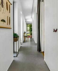 a hallway of a house with white walls at Architect Villa By Cliff Bathing In High Coast in Härnösand