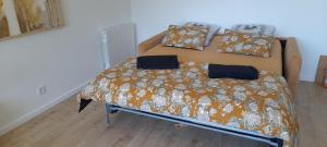 a bedroom with a bed in a room at Le Vivastella in Cucq