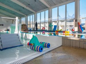 a water park with a pool with toys in the water at Søndervig Holiday Center in Ringkøbing +69 photos