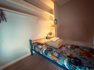 a bedroom with a bed with a colorful comforter at Las Vegas Simple bed Share room in Las Vegas