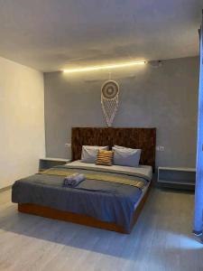 a bedroom with a large bed in a room at WHITE SANDS RESORT in Gili Trawangan