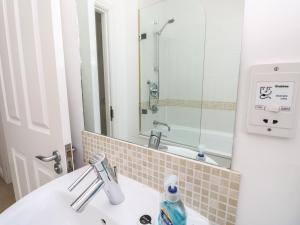 a bathroom with a sink and a mirror at Delaware M2 in Yarmouth +23 photos