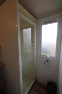 a walk in closet with a window in a room at Blueportel Horizon L40 in Le Portel