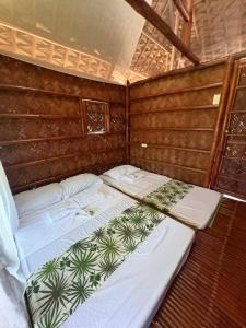 a couple of beds in a room at Ciudad Caliente by The Lavana in Talisay +38 photos