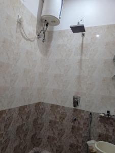 a bathroom with a shower and a sink at Karmawas House in Jodhpur