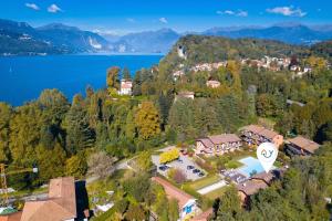 an aerial view of a house with a lake at Lenni Apart. Swimming Pool and lake + WIFI - Happy Rentals in Leggiuno +16 photos