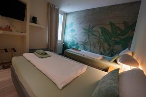 a hotel room with two beds and a window at Pension Dortmund Messe in Dortmund