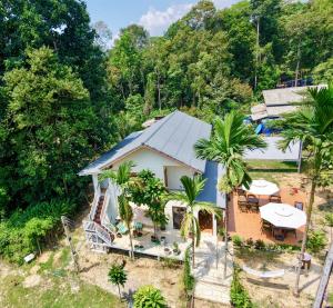 an aerial view of a house with palm trees at Bearwolf Koh Kood in Ko Kood