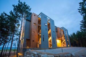 a large building with a lot of windows at Gosung La Henne Pull Villa J in Goseong