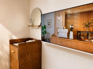 a kitchen with a counter and a counter at Moonraejung Hostel in Seoul +46 photos