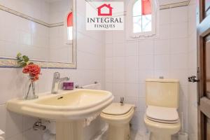 a white bathroom with a sink and a toilet at Casa Aiguamarina in Palamós +39 photos