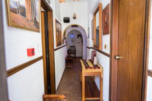 a hallway of a house with a table and chairs at Spot Hotel in Rhodes Town