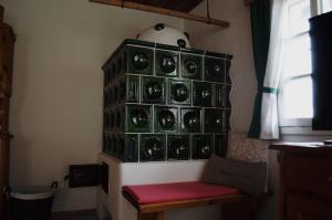 a room with a wall full of wine glasses at Ferienhaus Trausibauer in Stainz +14 photos
