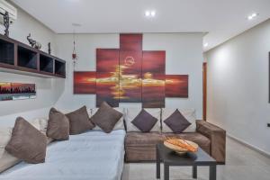a living room with a couch and a table at Casa Emma in Playa Honda