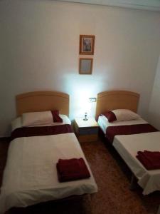 Ein Bett oder Betten in einem Zimmer der Unterkunft La Herrada