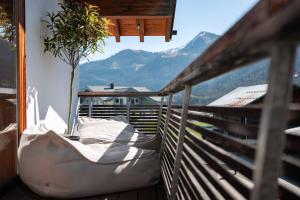 a balcony with a view of the mountains at Loft7 in Mittelberg