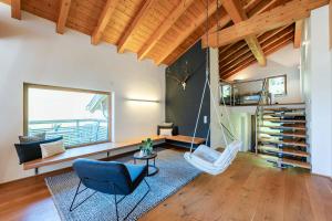 a living room with a hammock in a house at Loft7 in Mittelberg