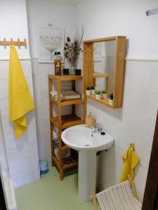 a bathroom with a sink and a mirror at Apartamento Valdenieve VUTE-15-041 in Valdelinares +6 photos