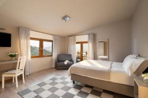 Llit o llits en una habitació de Hotel Saligari