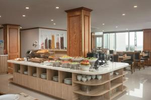 a buffet in a restaurant with food on display at Hanoi Sail Hotel in Hanoi +75 photos