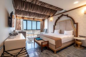 a bedroom with a bed and a desk in a room at Ween Otel in Trabzon +93 photos