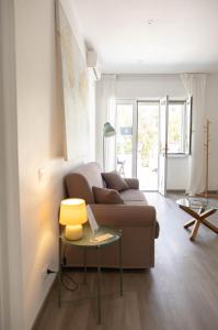 a living room with a couch and a table at Villa Valentina in Taranto